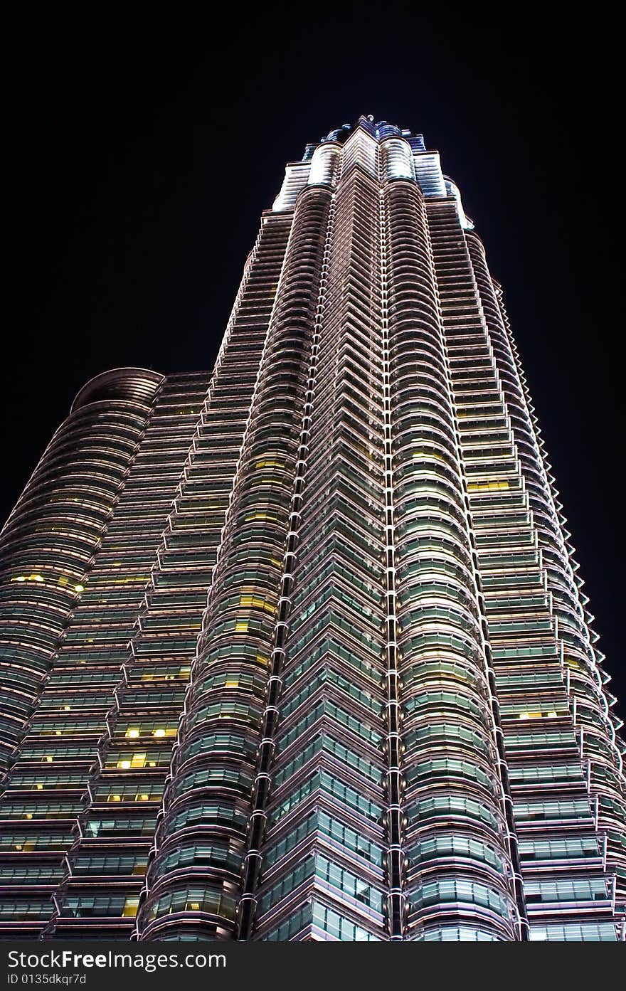 Twin towers seen from below by night