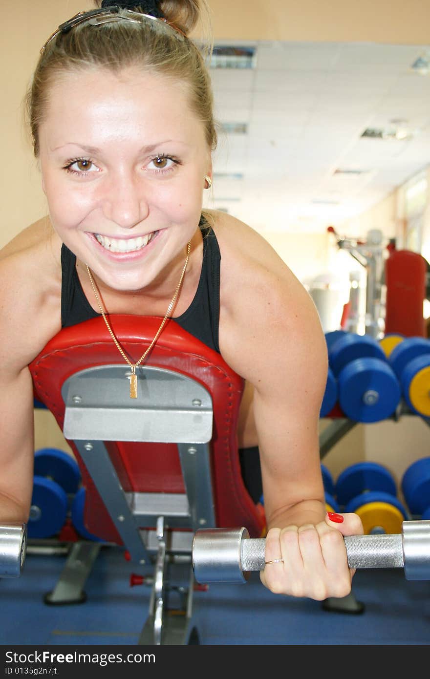 Young, beautiful woman in sport hall. Young, beautiful woman in sport hall