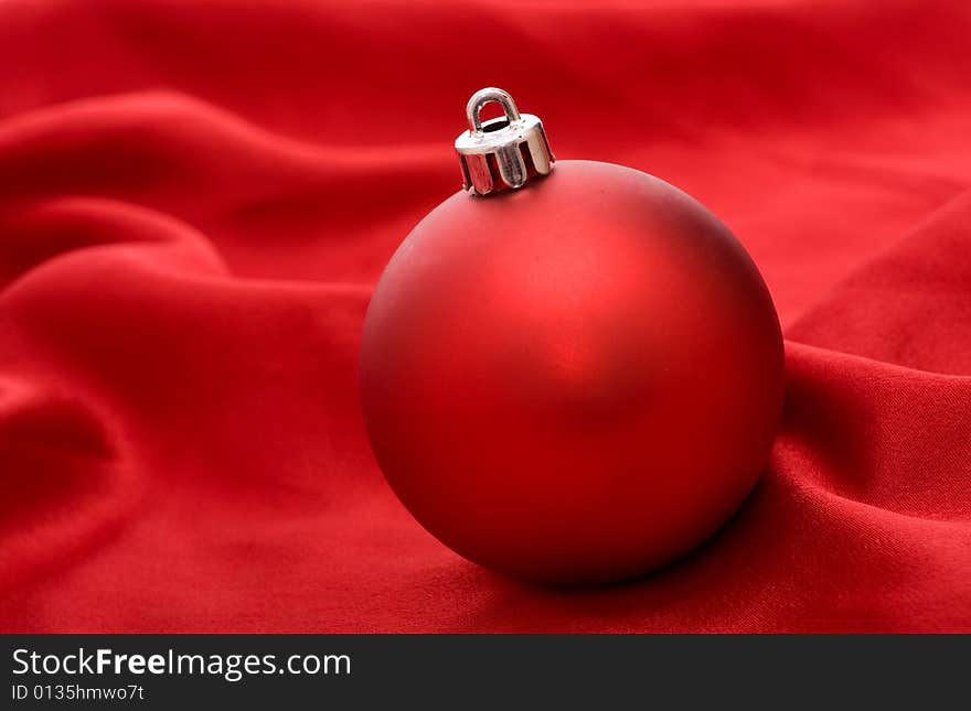 Red ball on red background - Christmas decoration. Red ball on red background - Christmas decoration