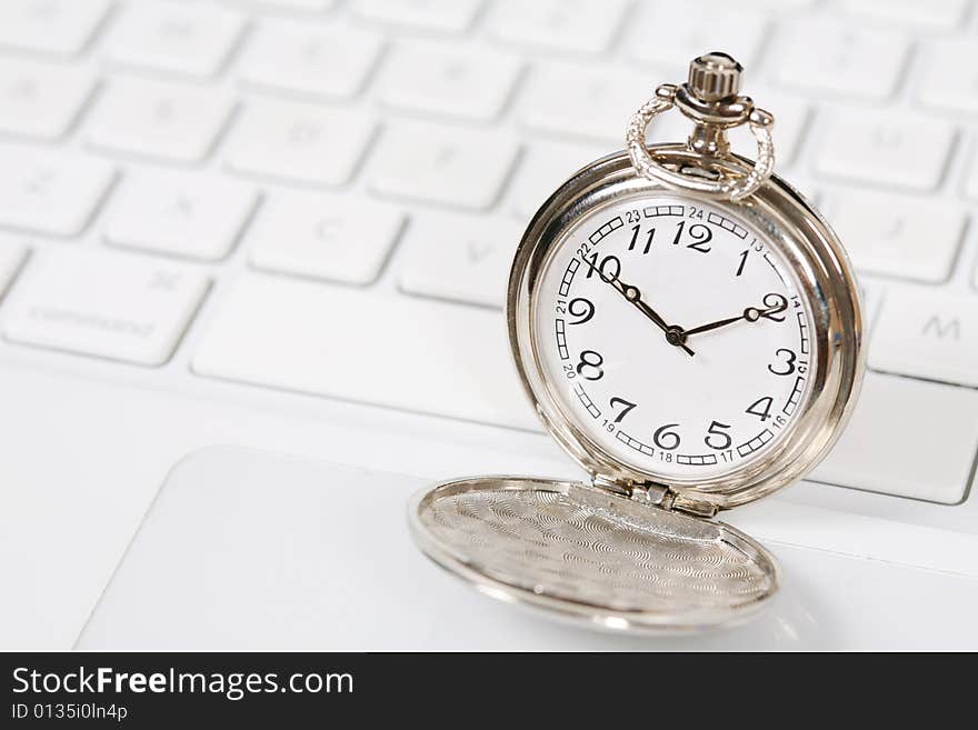 Pocket watch with white keyboard. Pocket watch with white keyboard