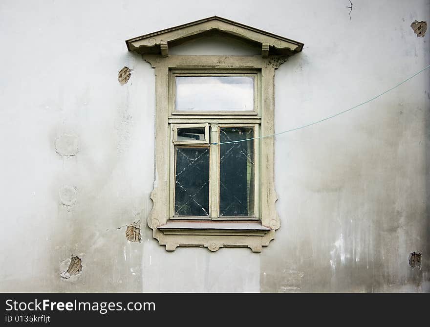 Grey wall of an old building with window. Grey wall of an old building with window