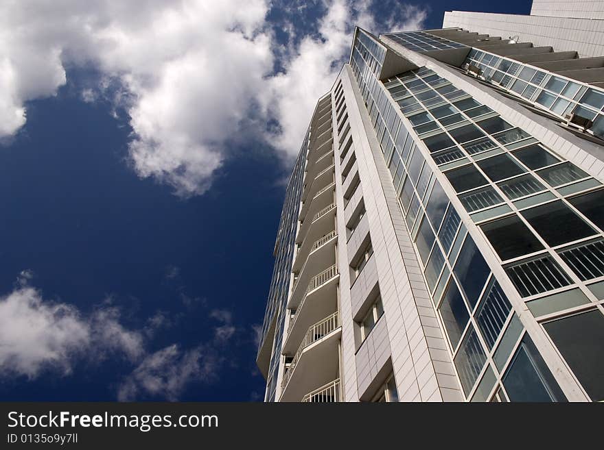 Modern urban building. Glass balconies. Modern urban building. Glass balconies.