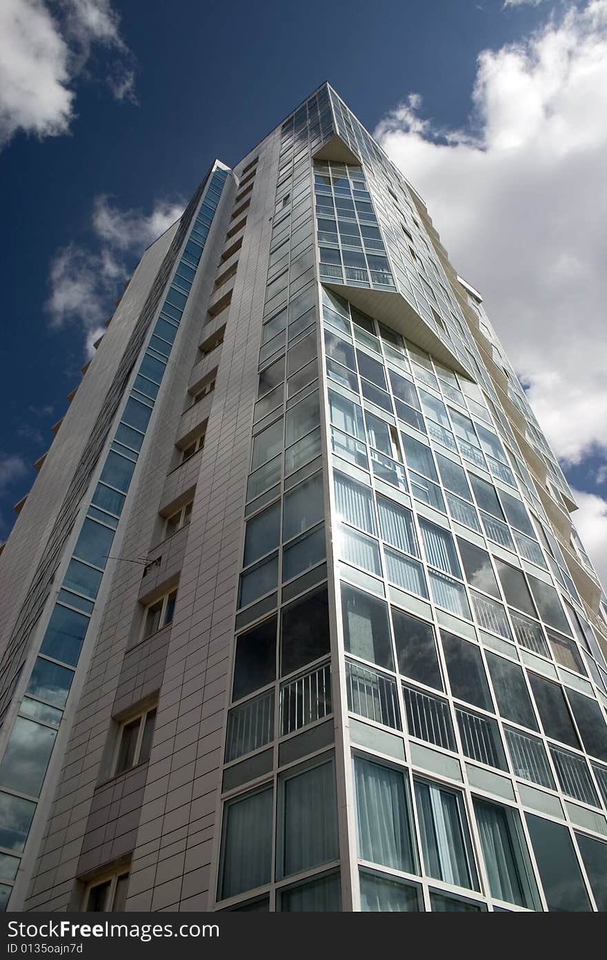 Modern urban building. Glass balconies. Modern urban building. Glass balconies.