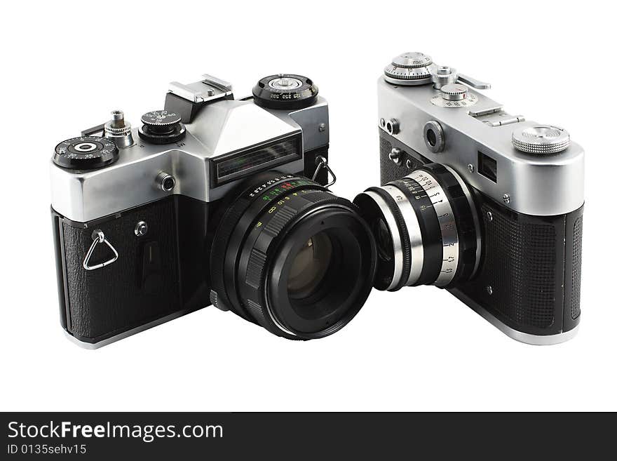 Two ancient film mirror camera of the last century. It is isolated on a white background. Two ancient film mirror camera of the last century. It is isolated on a white background