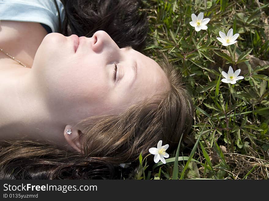 Young woman lying on grass