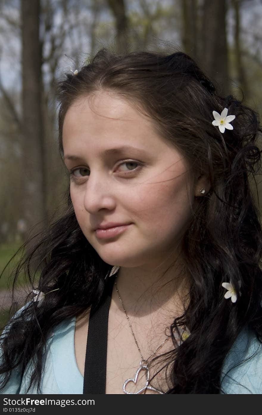 Young woman with white flowers in hair