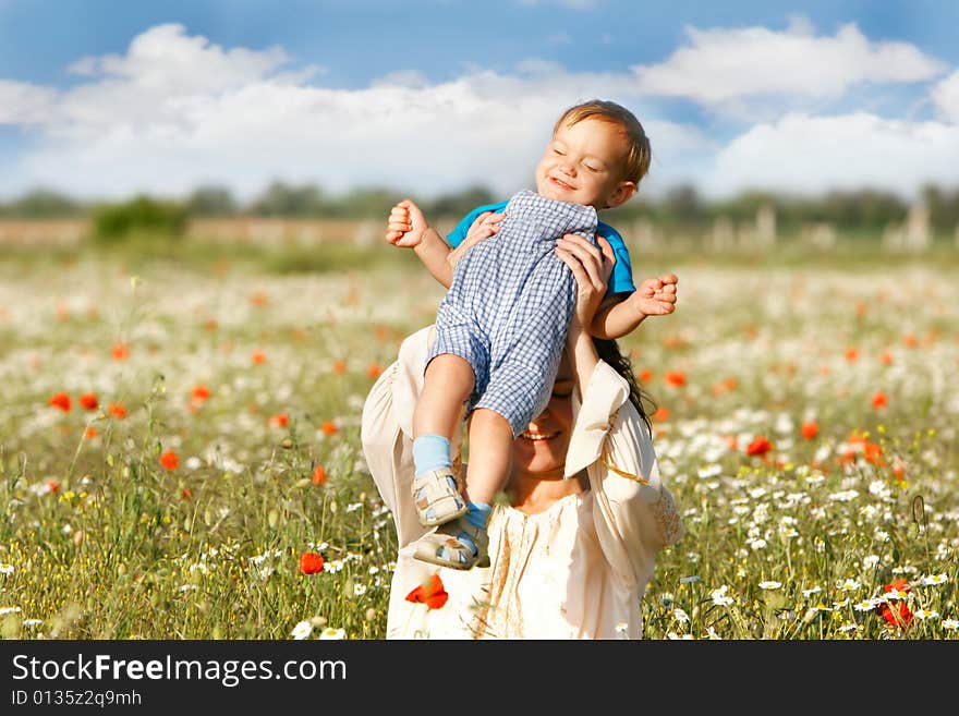 Mother and son on natural background