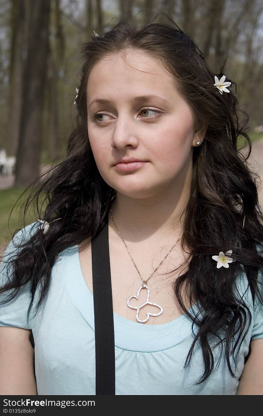 Young woman with white flowers in hair