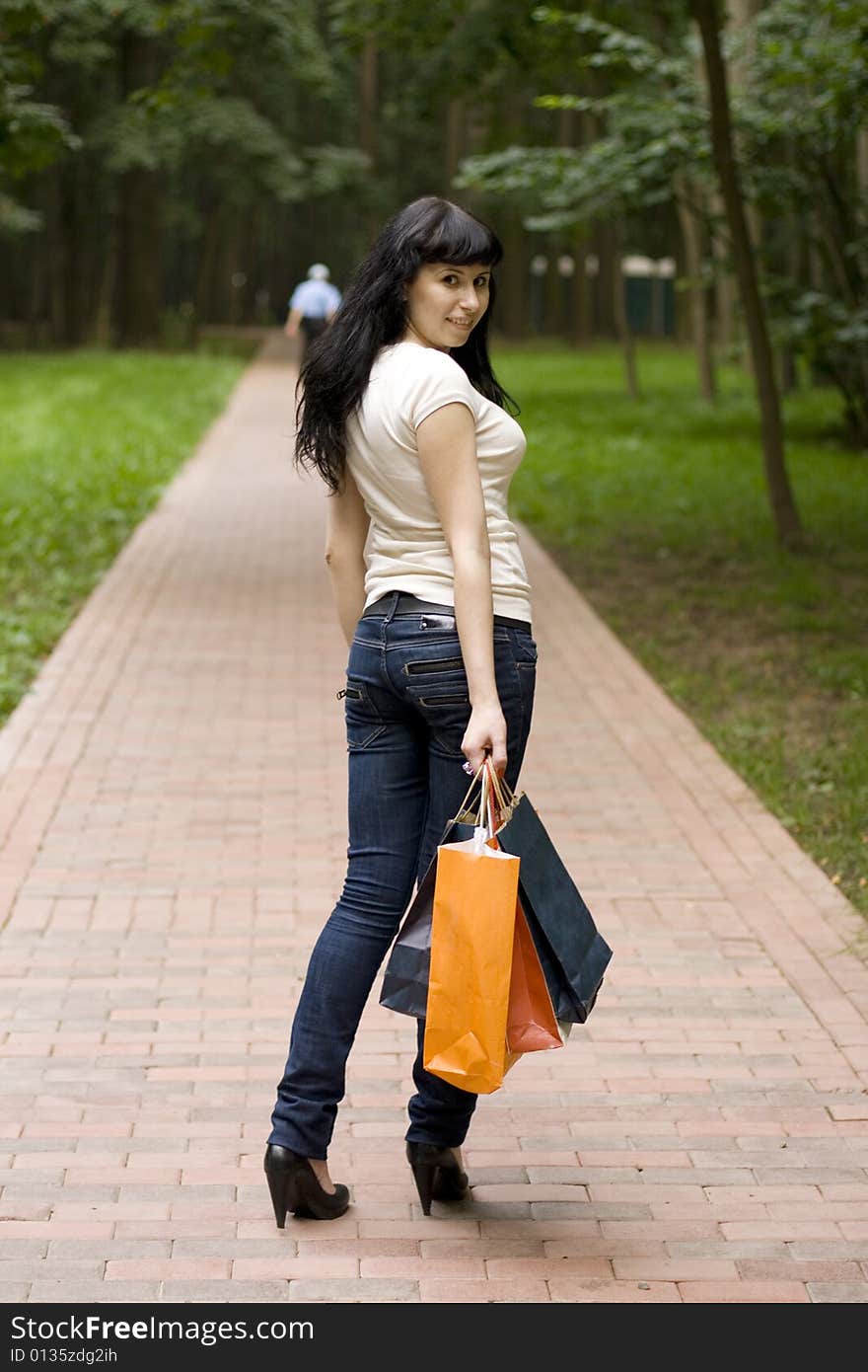 Brunet girl with shopping bags