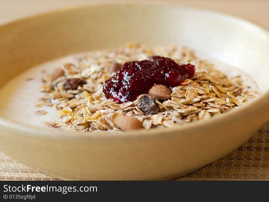 Muesli with raspberry jam