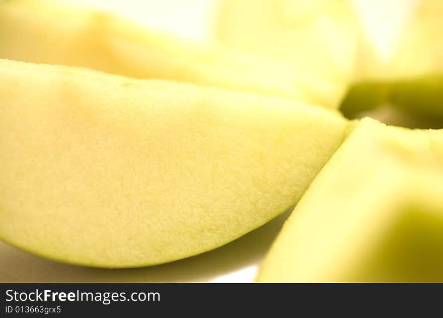 A few slices of apple on a white background. A few slices of apple on a white background