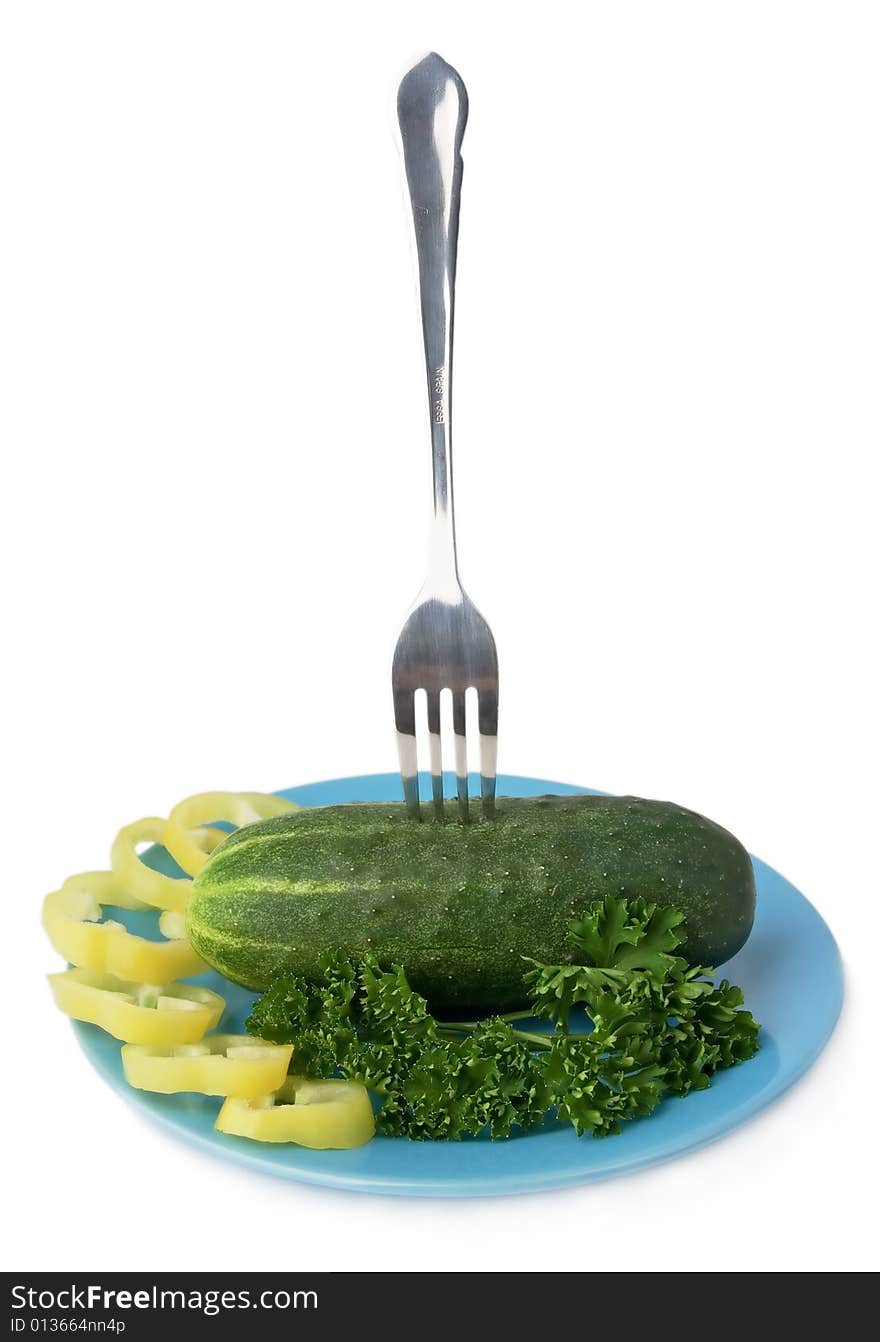 Fork and cucumber on a plate