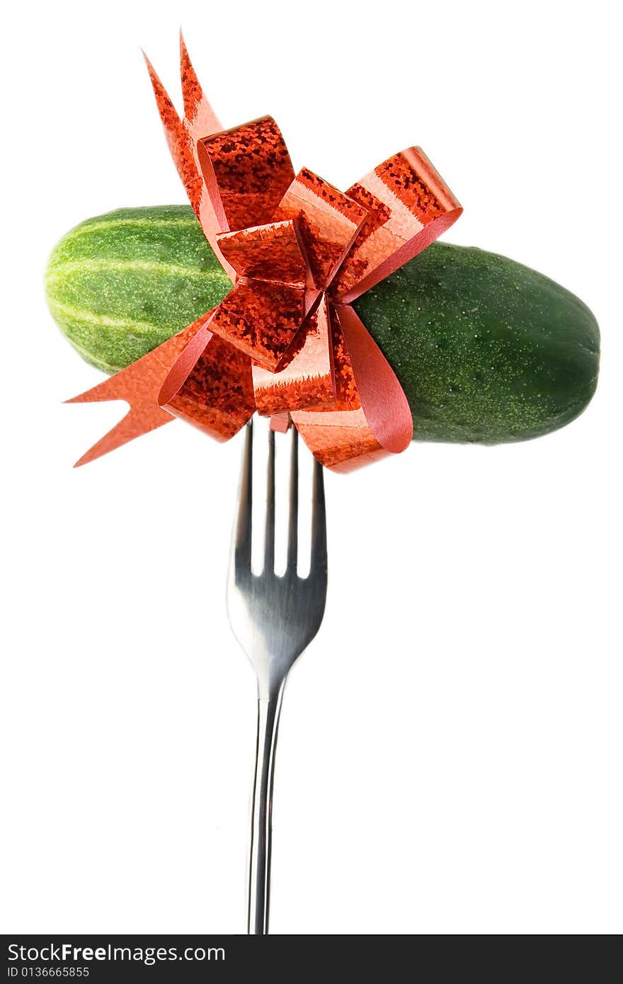 Cucumber with red bow on fork