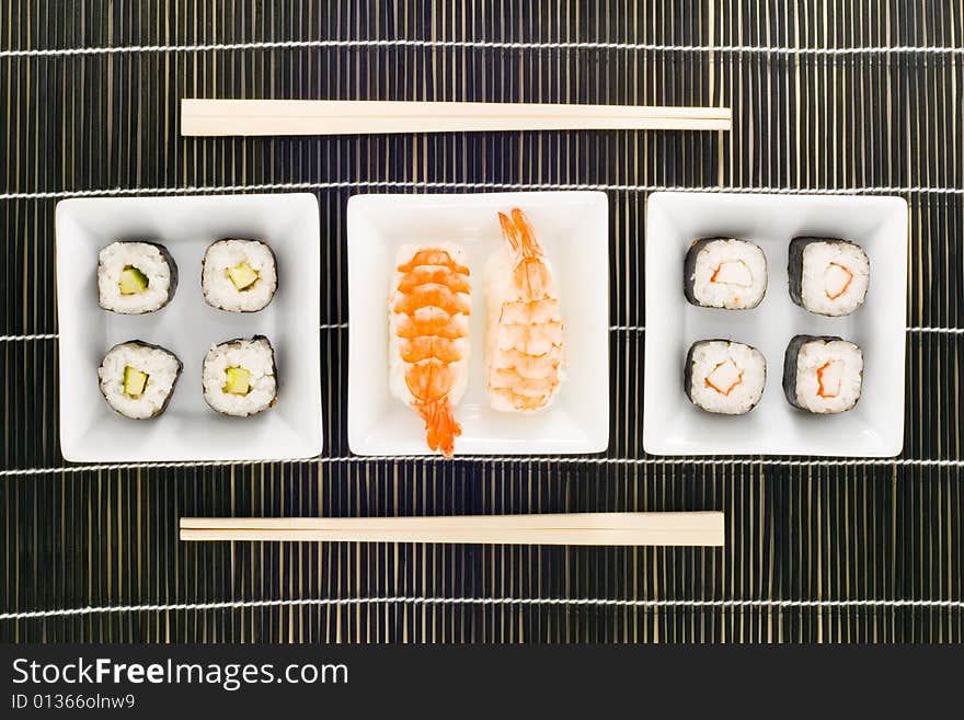 Three plates with different kinds of sushi