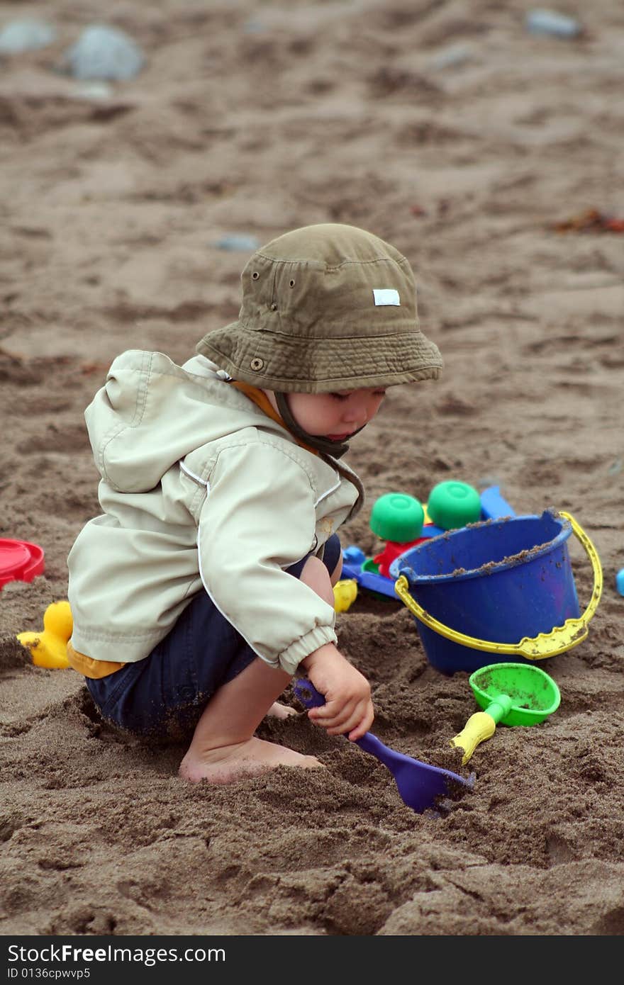 Boy Playing in Sand