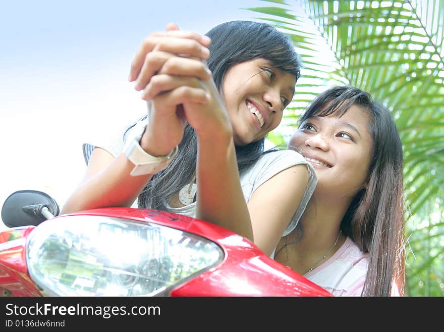 Girls having fun on bike