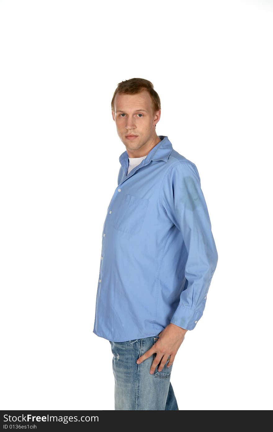 Serious looking attractive young man in blue shirt. Serious looking attractive young man in blue shirt