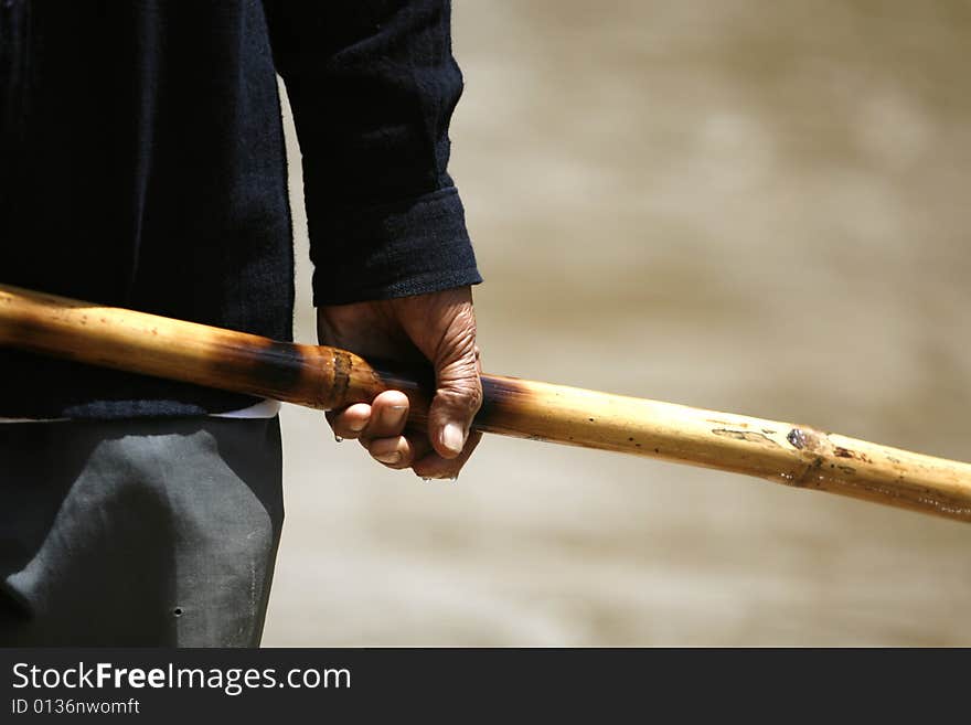 An old man do canoe in a river