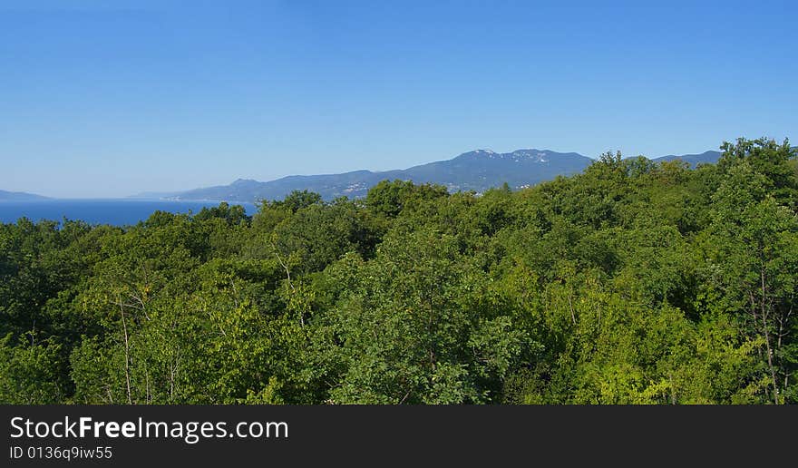 Landscape panorama of Kvarner Bay in Croatia, view of the coastline and Mountain Ucka, sea and Cres Island

*horizontal panoramic image, 2 images stitched together 
**with space for text (copyspace). Landscape panorama of Kvarner Bay in Croatia, view of the coastline and Mountain Ucka, sea and Cres Island

*horizontal panoramic image, 2 images stitched together 
**with space for text (copyspace)