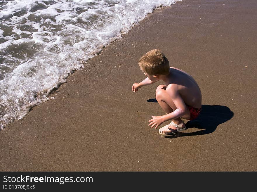 Child playing on the beach. Child playing on the beach