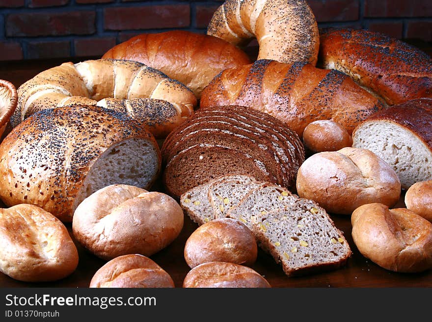 Different sorts of the bread lying on the table. Different sorts of the bread lying on the table