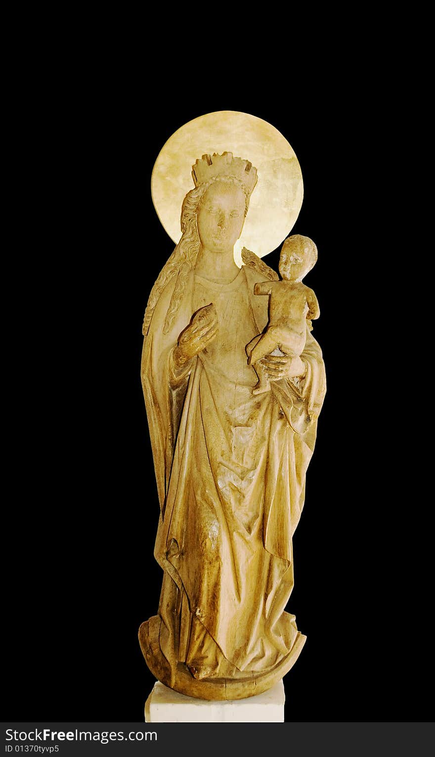 A wooden figure of Maria with the Jesus child in her arms. A wooden figure of Maria with the Jesus child in her arms