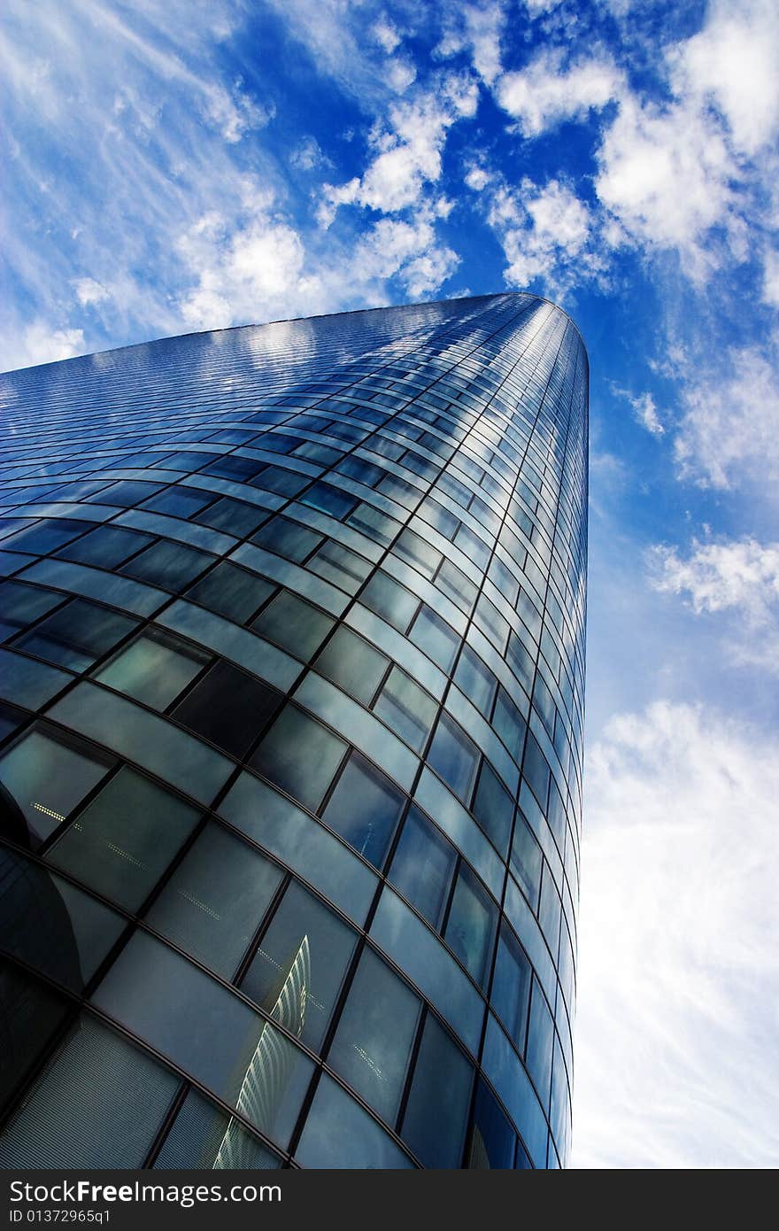 Futuristic skyscraper under blue sky. Futuristic skyscraper under blue sky