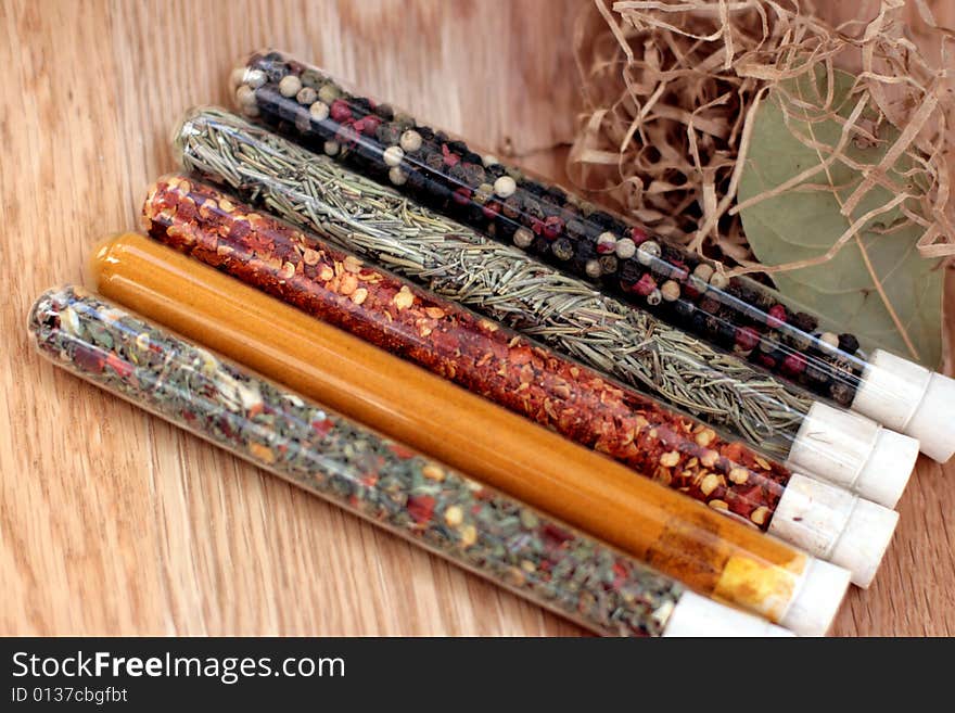 Spices in a glass on wood table. Spices in a glass on wood table