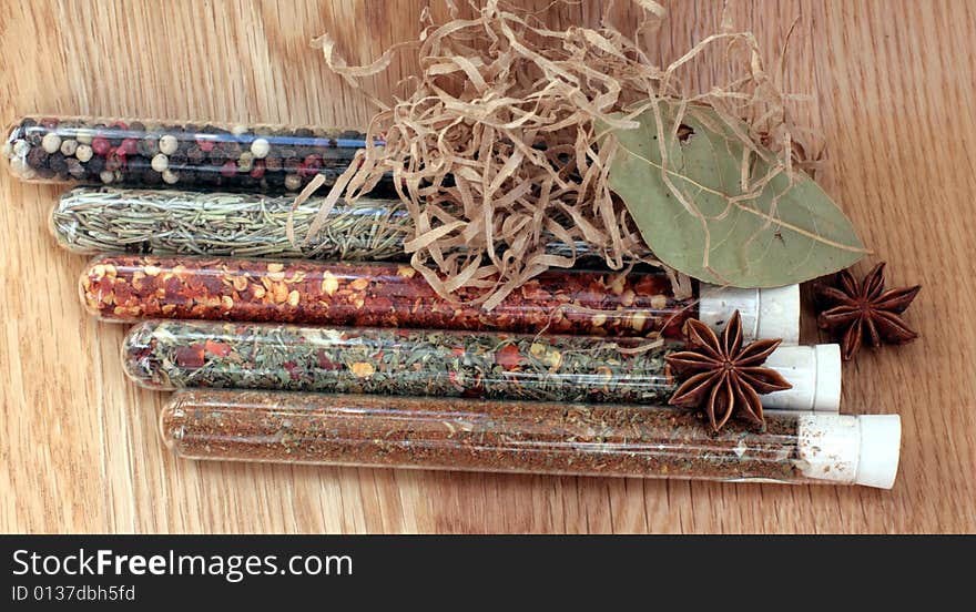 Spices in a glass on wood table. Spices in a glass on wood table