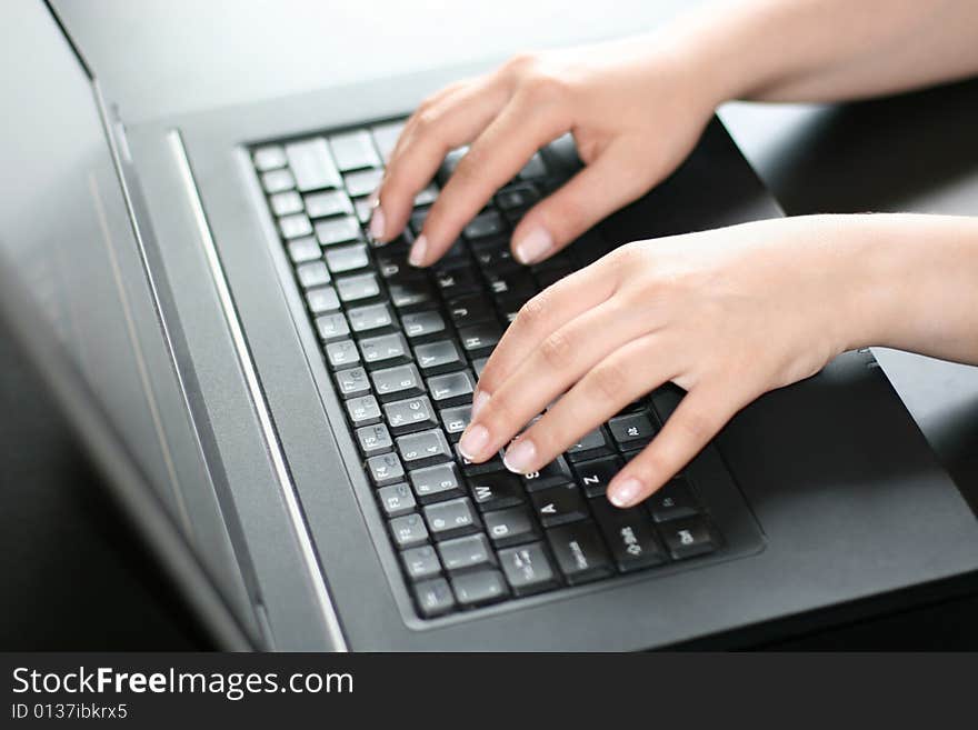 Woman working on a laptop. Woman working on a laptop