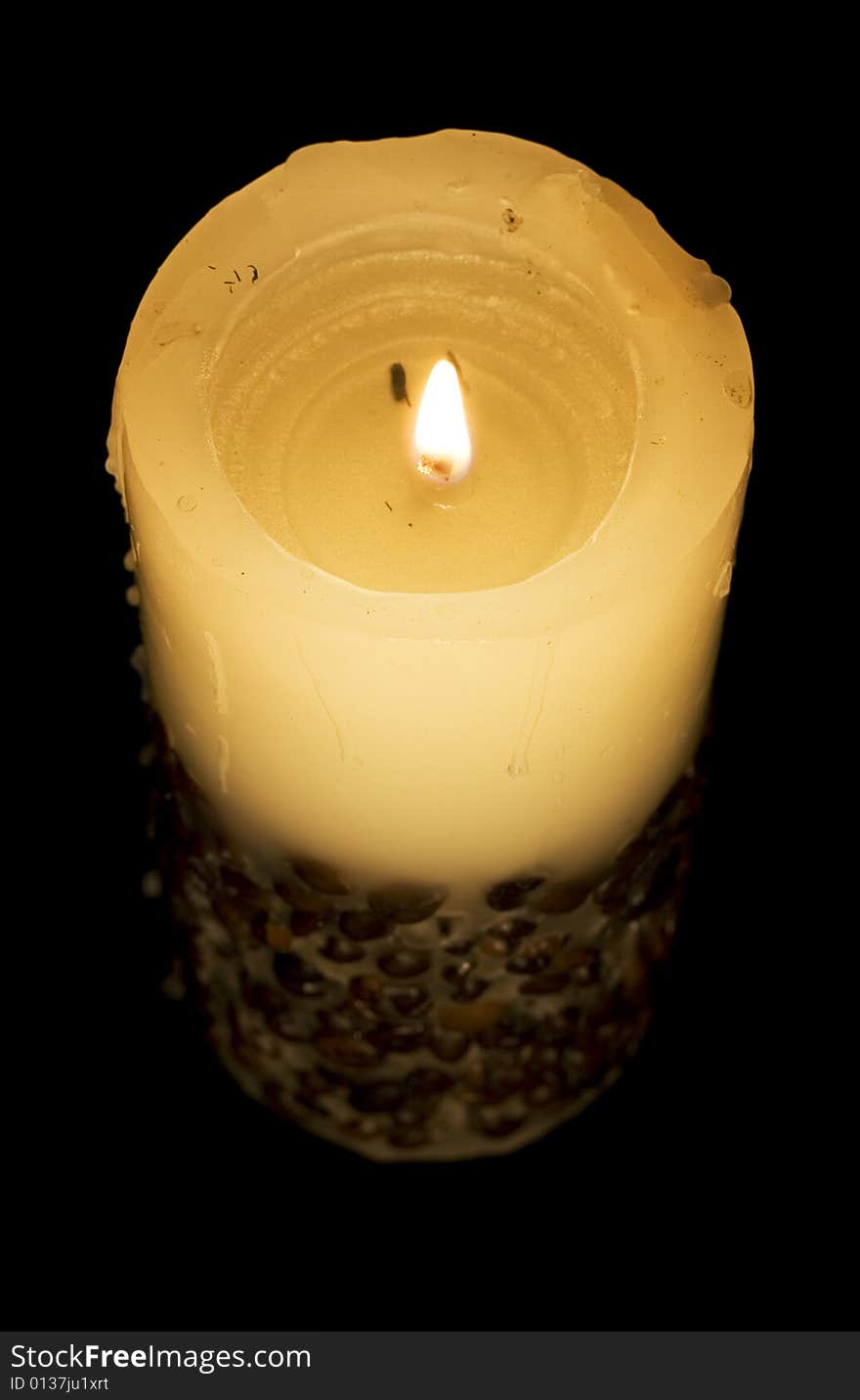 Candle isolated on black background