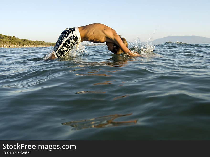 Boy diving into the sea. Boy diving into the sea