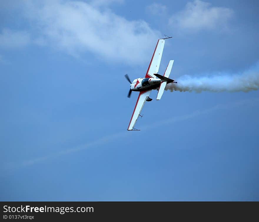 Aircraft in the acrobatic flight. Aircraft in the acrobatic flight