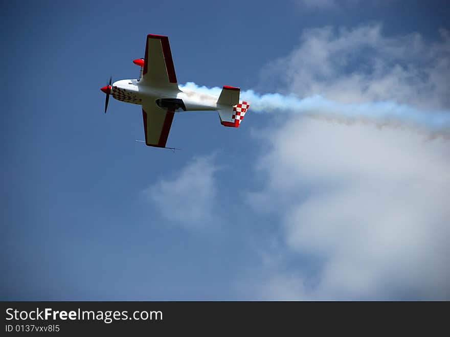 Aircraft in the acrobatic flight. Aircraft in the acrobatic flight