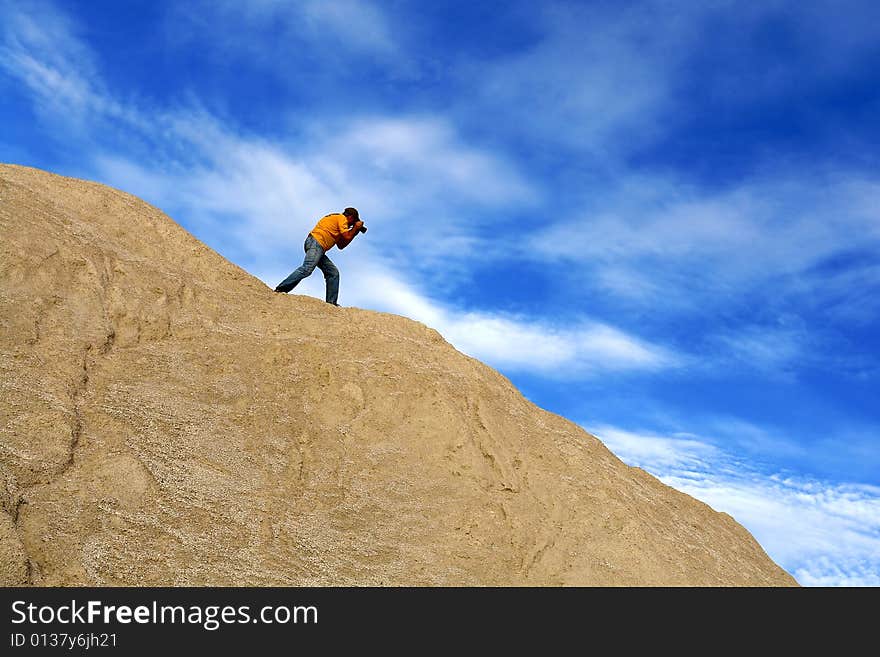 Shot of the photographer on the top of hill. Shot of the photographer on the top of hill