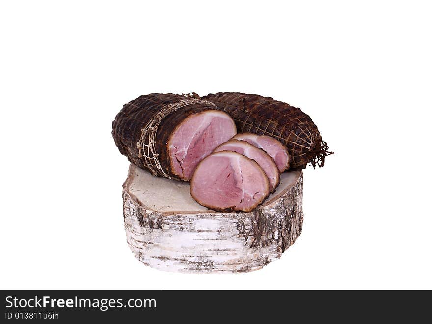 Ham lying on birch stump isolated on white background. Ham lying on birch stump isolated on white background