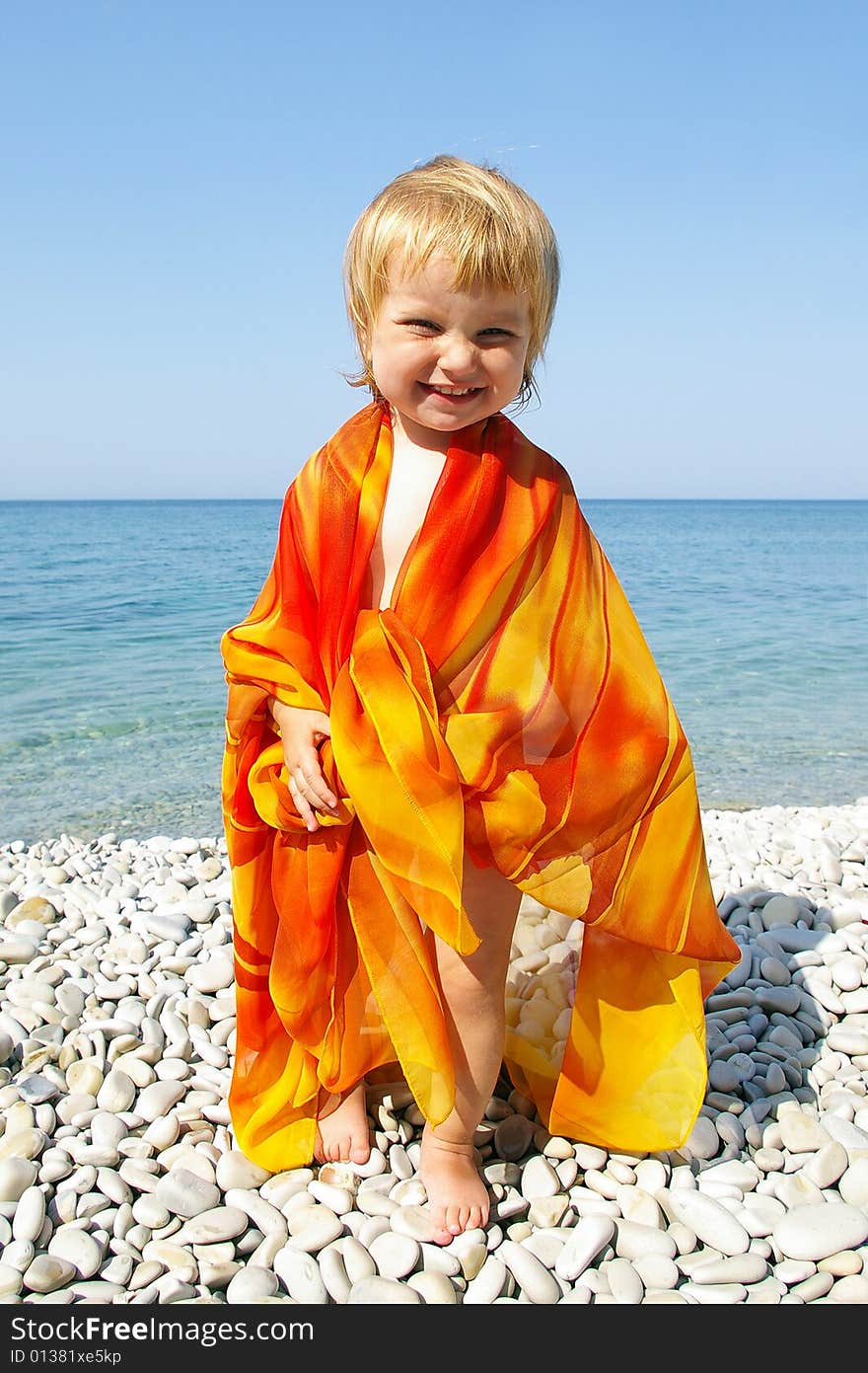 Cute little girl on seacoast and her beautiful smile