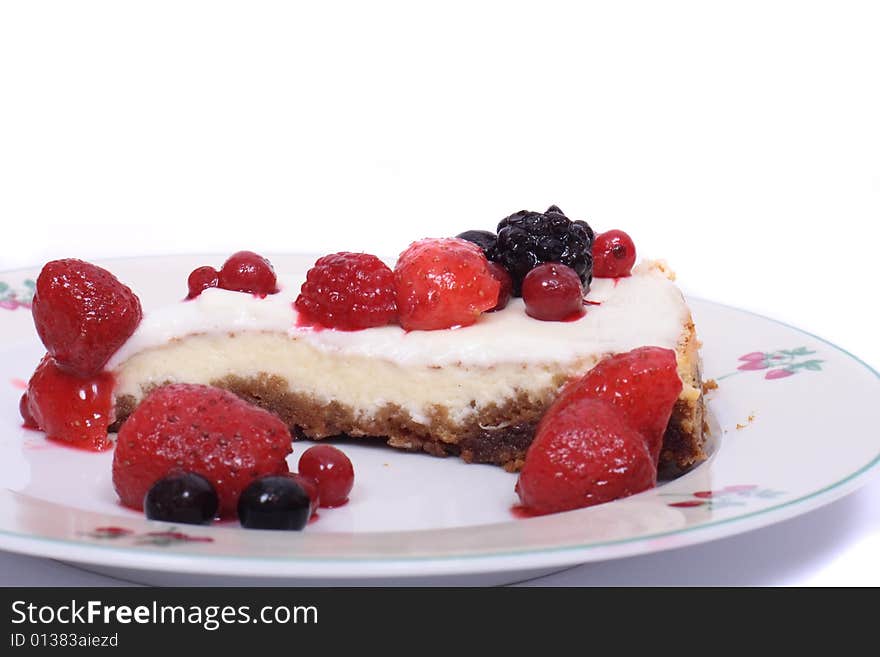 Cheesecake with fruits on the white background