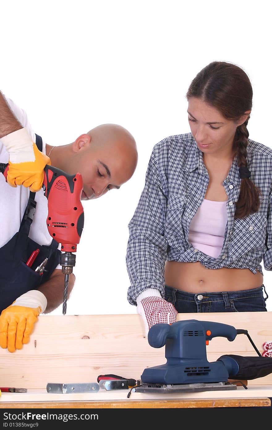 Construction workers at work on white background