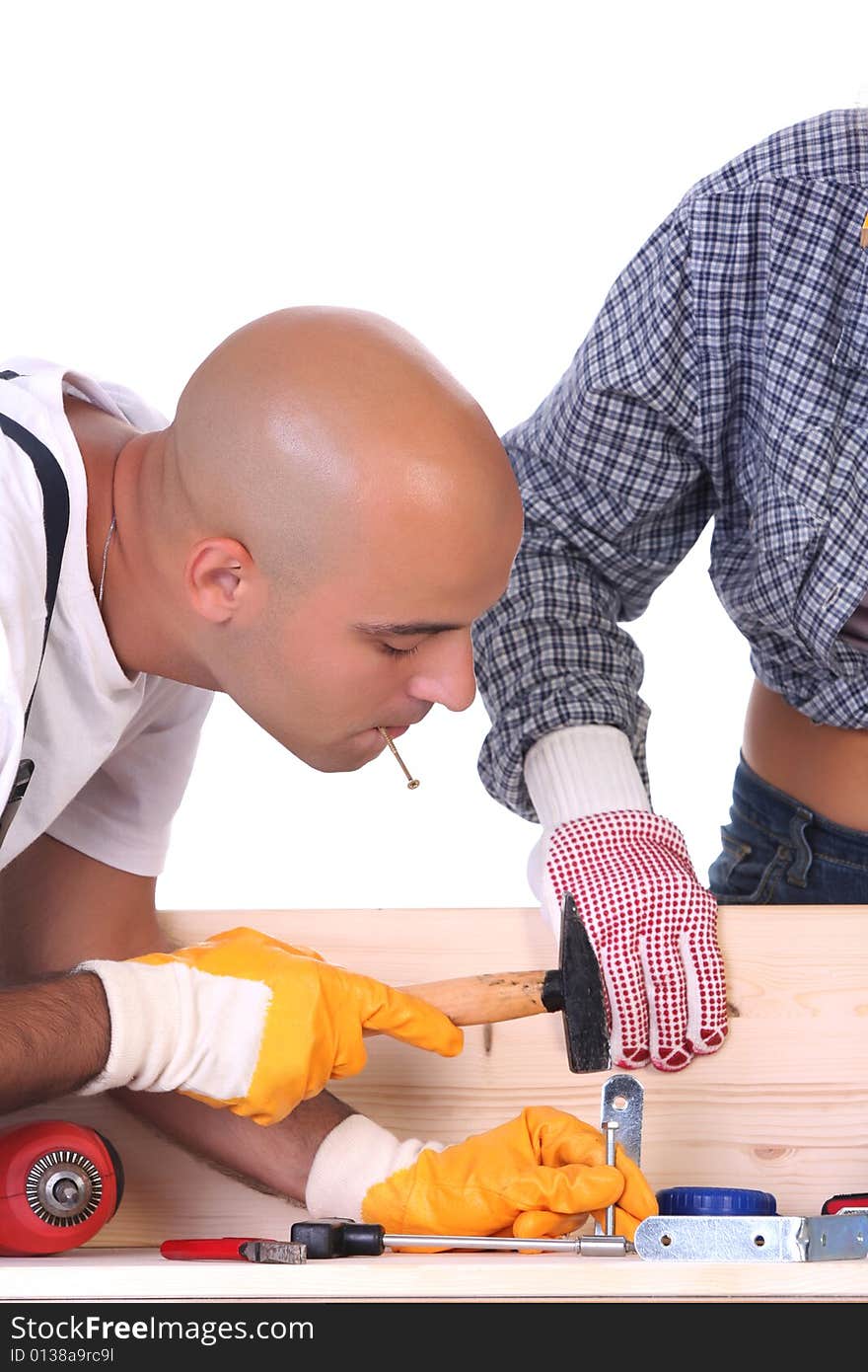 Construction workers at work on white background