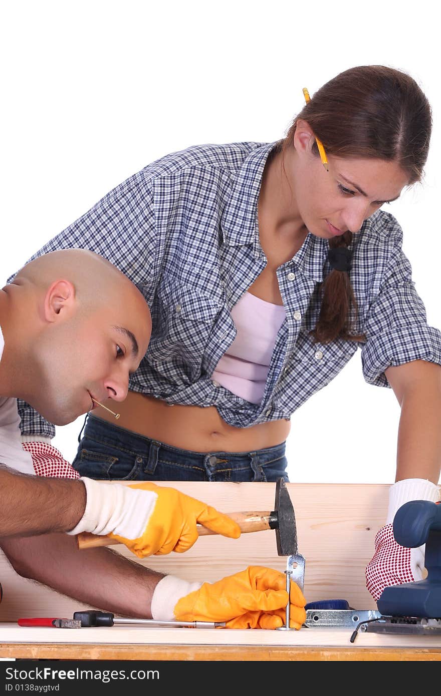 Construction workers at work on white background