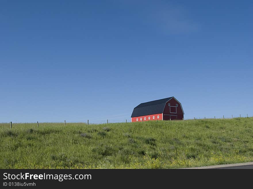 Old barn on green hillside