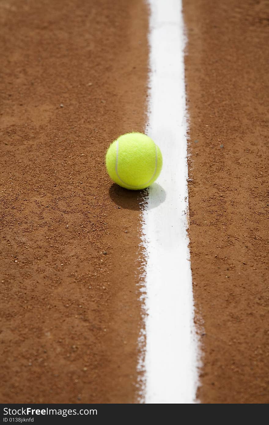 Tennis ball and white line