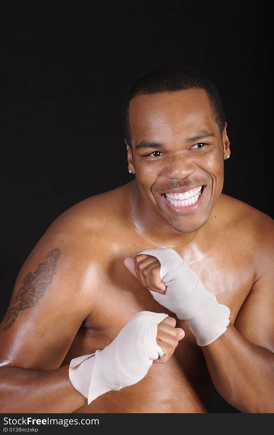 Smiling young African American boxer during workoput