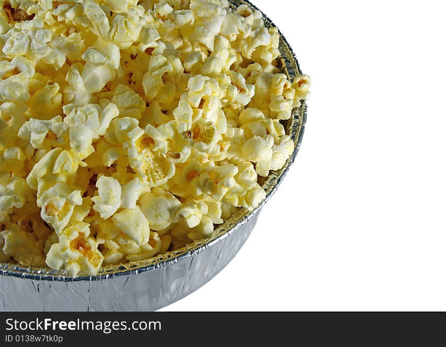 Freshly popped popcorn in an aluminum bowl. Freshly popped popcorn in an aluminum bowl.