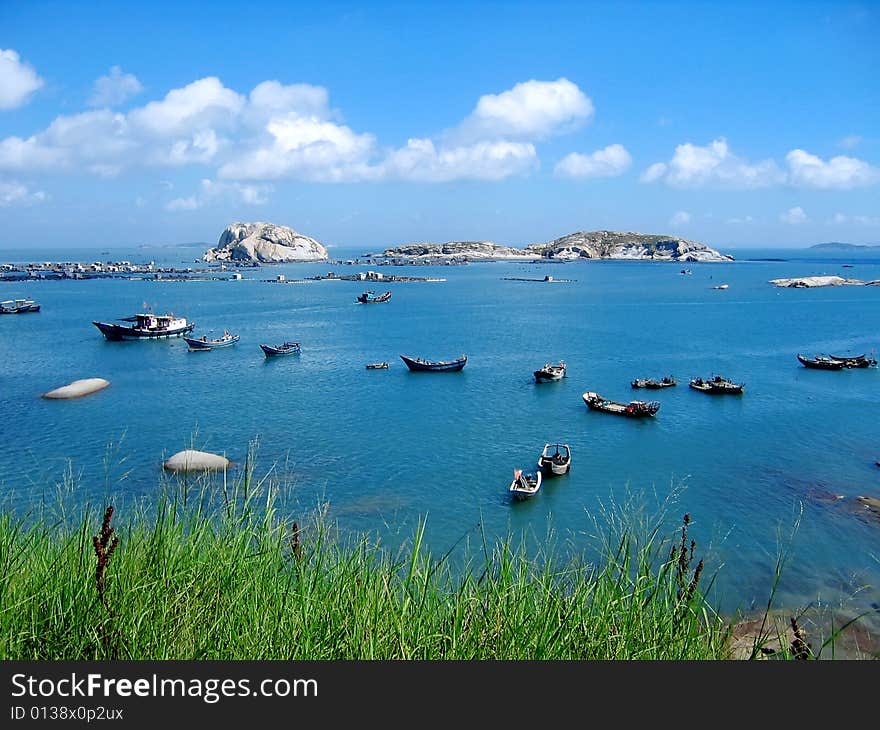 Under blue color sky and many boats on sea. Under blue color sky and many boats on sea