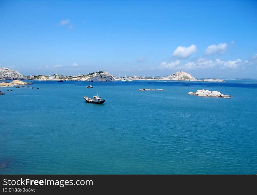 Under blue color sky and many boats on sea. Under blue color sky and many boats on sea