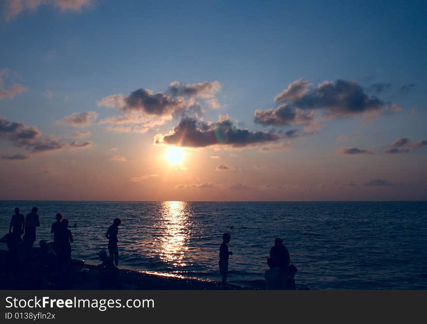 Sundown sun on background sky with cloud on sea beach