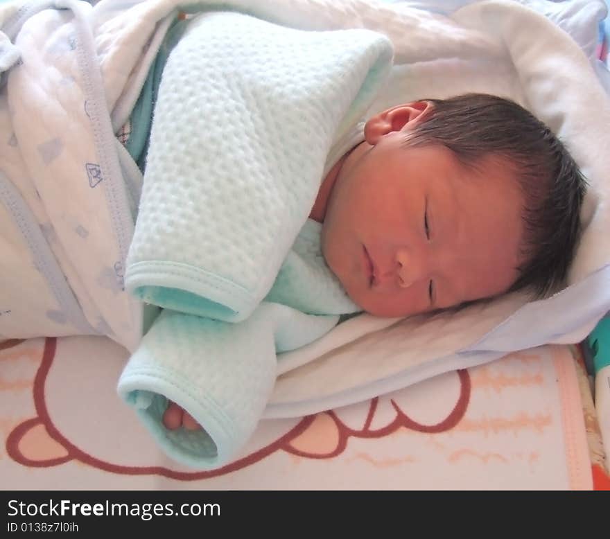 Sleeping Baby on a bed