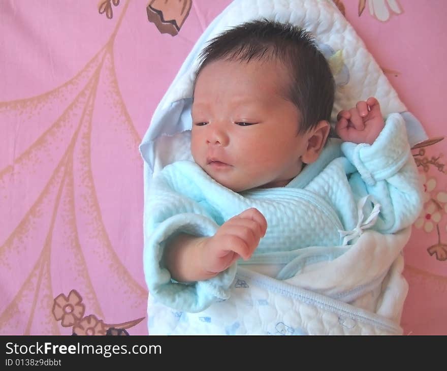 Lovely Baby on a bed